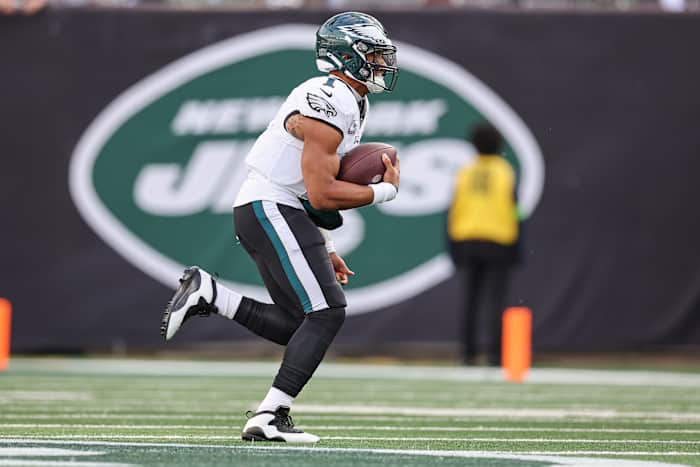 Philadelphia Eagles quarterback Jalen Hurts runs with the football.